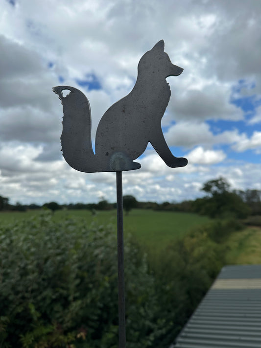 Metal Fox Sitting on a stake