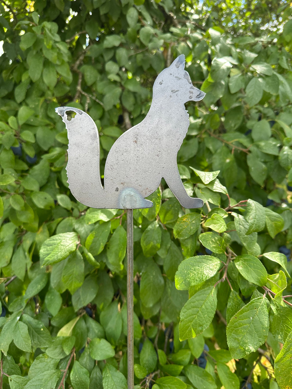 Metal Fox Sitting on a stake