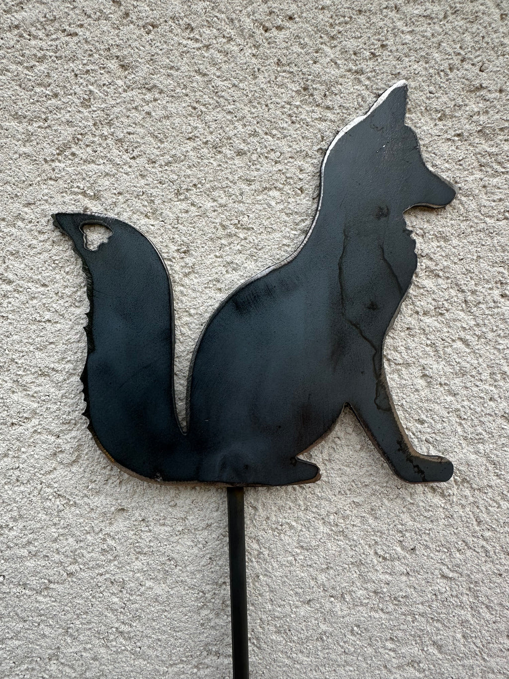 Metal Fox Sitting on a stake