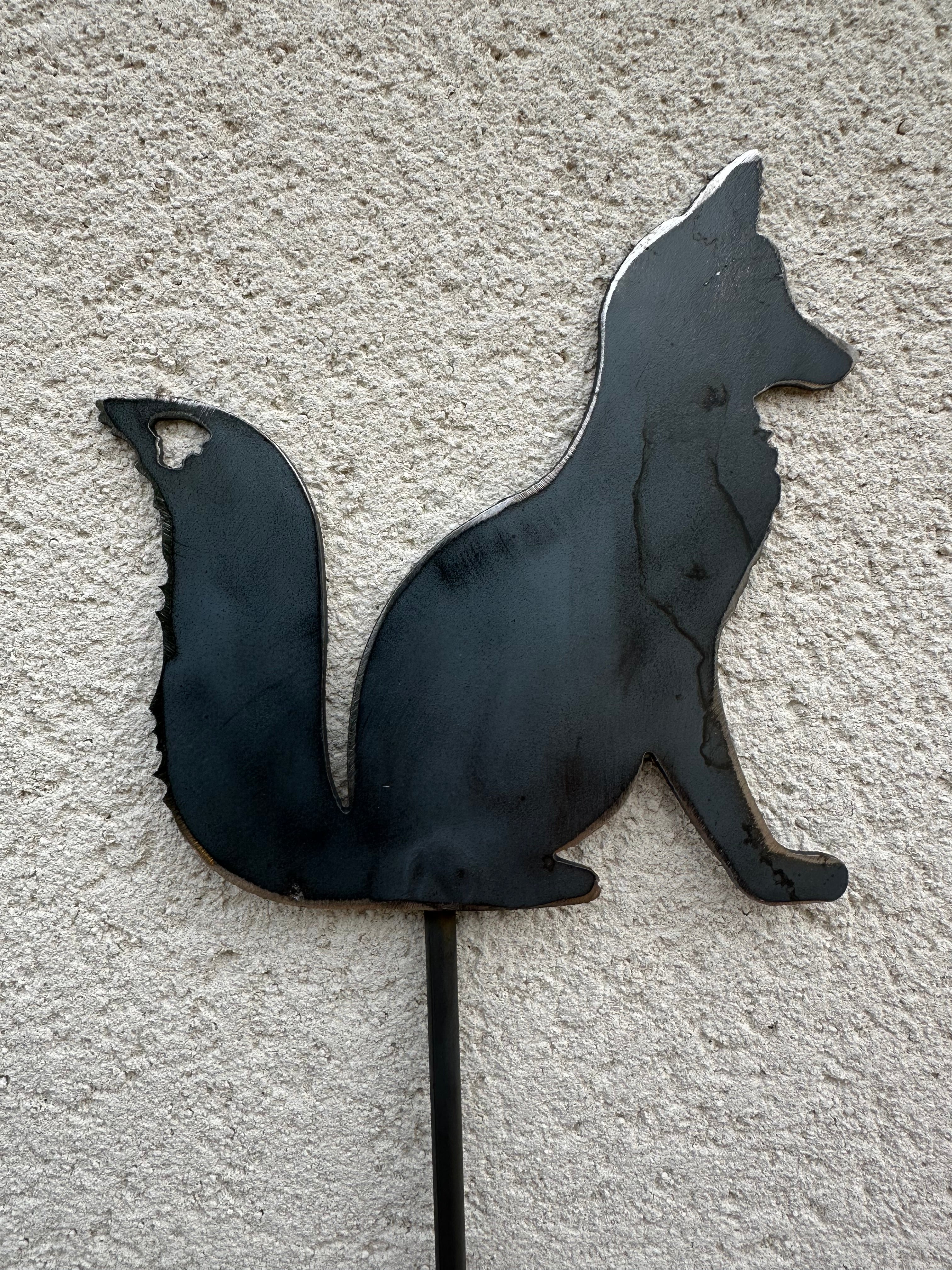Metal Fox Sitting on a stake
