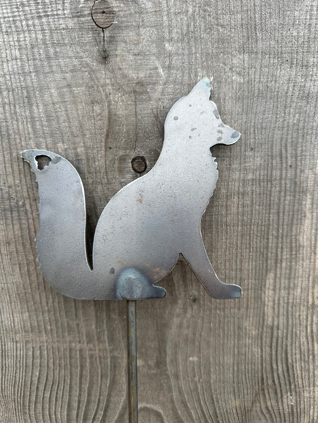 Metal Fox Sitting on a stake