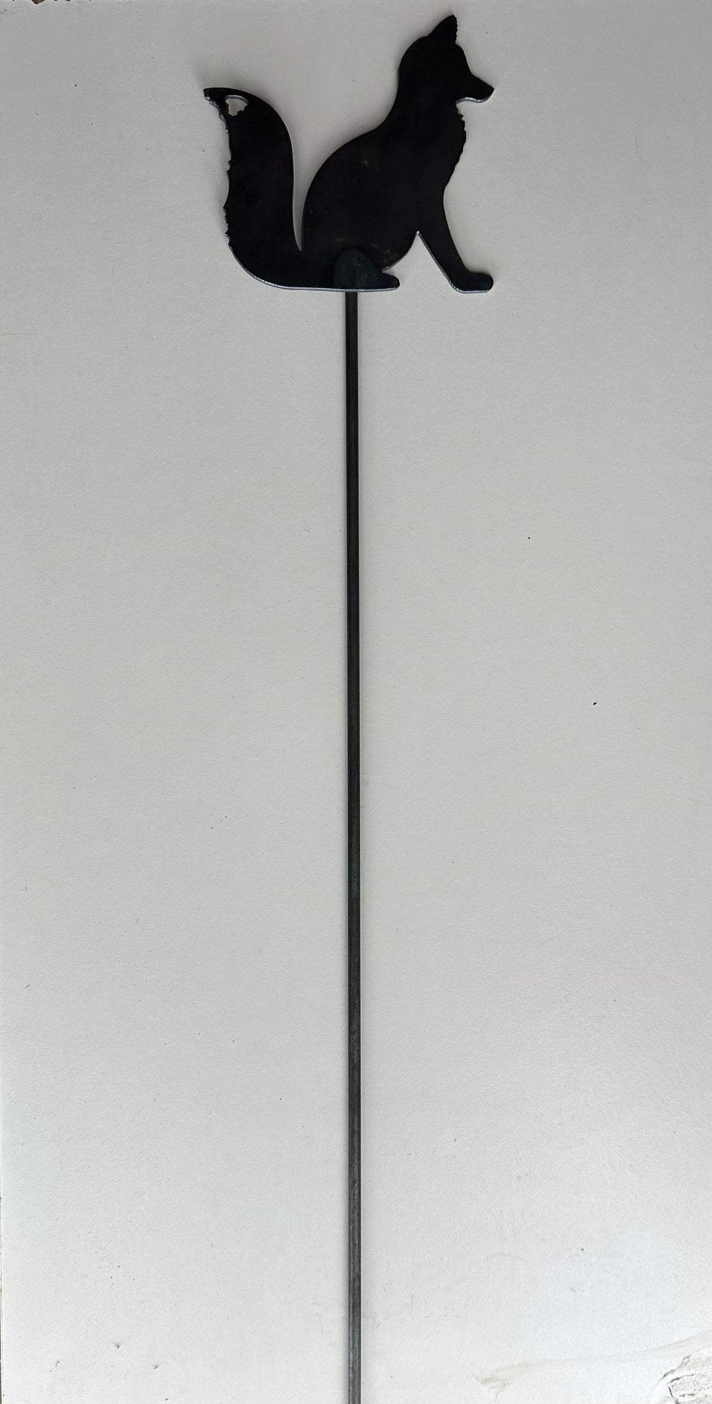 Metal Fox Sitting on a stake